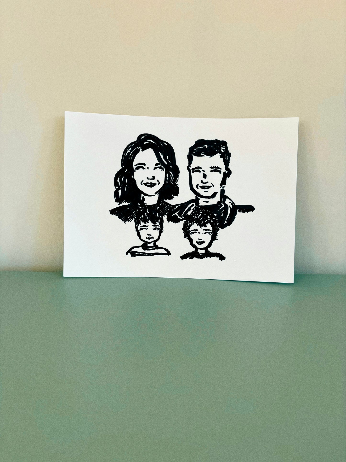 A cute hand drawn portrait of a family on premium card stock. 